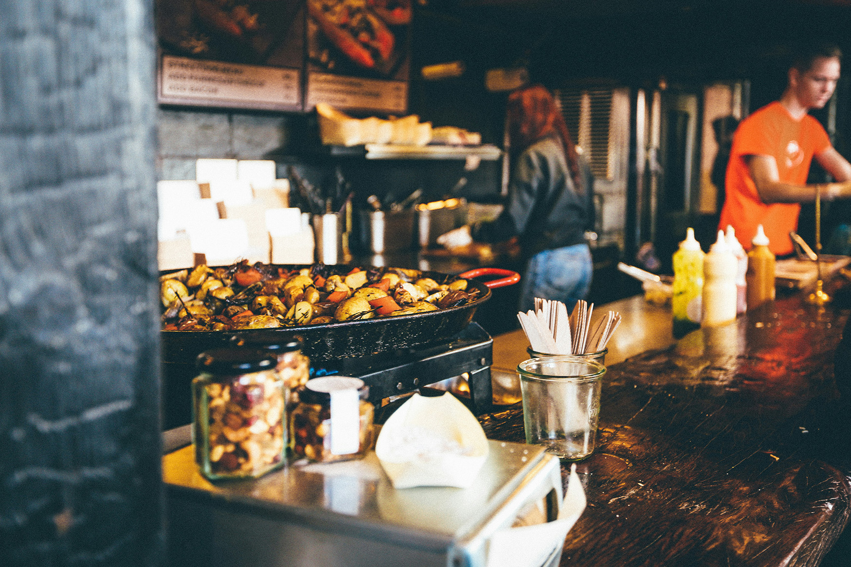 potatoes cooking behind counter